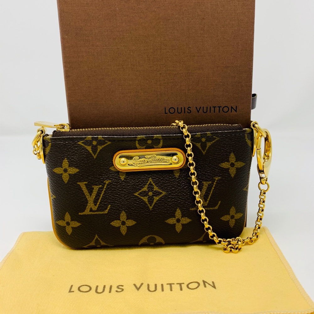 **SOLD**. LOUIS VUITTON MONOGRAM MILLA HAND POCHETTE